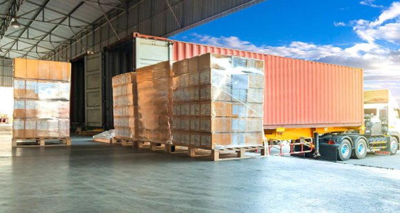 Pallet shipments being loaded onto truck for delivery