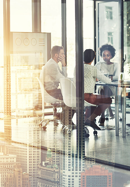 People in a glass conference room