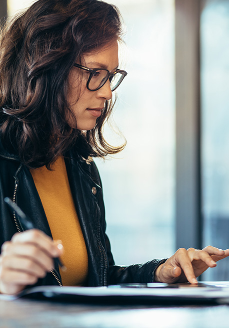 Woman in yellow at computer