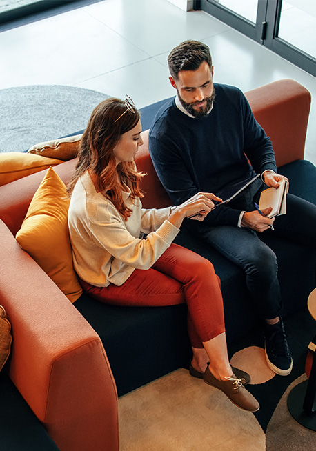 Man and woman sitting on chair